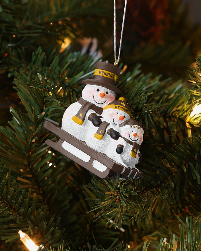Wyoming Cowboys Sledding Snowmen Ornament FOCO - FOCO.com